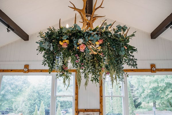 Wedding reception Antler Chandelier Flower Greenery Arrangement
